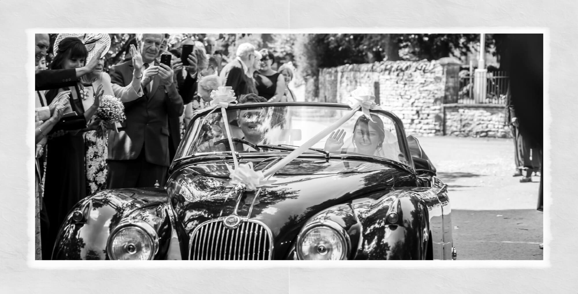 Warwick House wedding album page design showing bride and groom driving off in vintage Jaguar