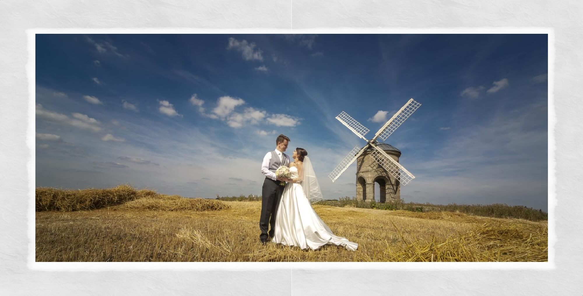 Warwickshire Wedding Photography at Warwick House: bride and groom stood in a corn field