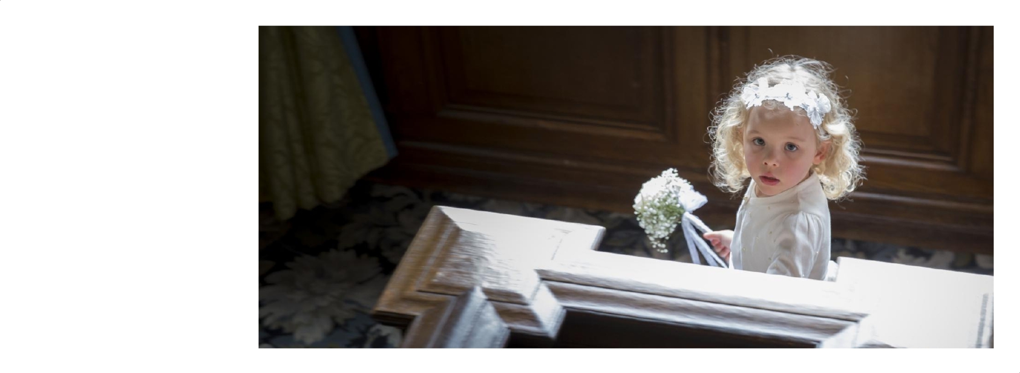 Wedding Photographer Warwickshire: Wedding album page showing flower girl on staircase