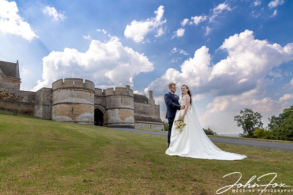 Wedding Photography at Rockingham Castle. Bride and groom in the grounds of the castle.