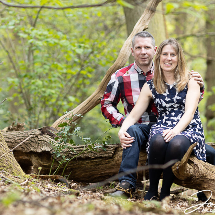Emily and Jay on their pre-wedding shoot in woodland in Northamptonshire