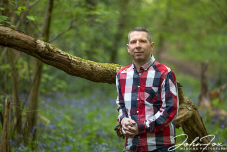 Groom on a pre-wedding shoot in woodland in Northamptonshire - John Fox Wedding Photography
