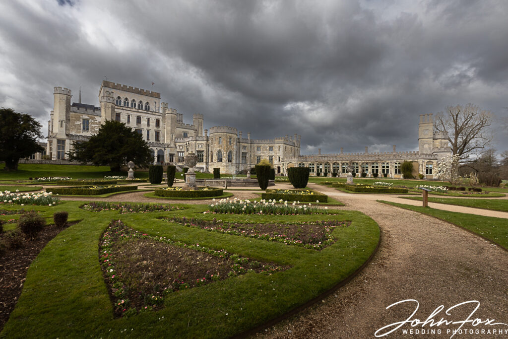 Dramatic image of Ashridge House with storm clouds in the background. Wedding photography Hertfordshire
