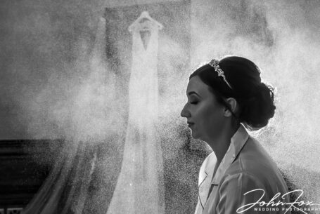Bridal preparations Ashridge House. Nicole in a cloud of hairspray. Wedding Photography at Ashridge House Hertfordshire