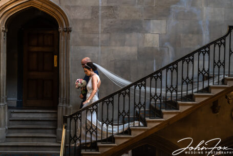 Nicole and her father descending the main stairs at Ashridge House, Hertfordshire