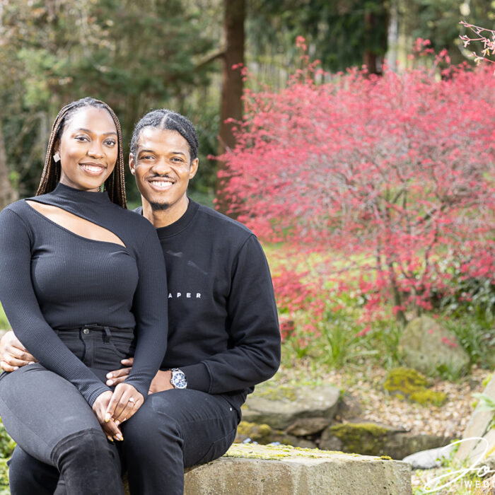 Oslyn and Yemi sitting in the gardens at Edgbaston Park Hotel