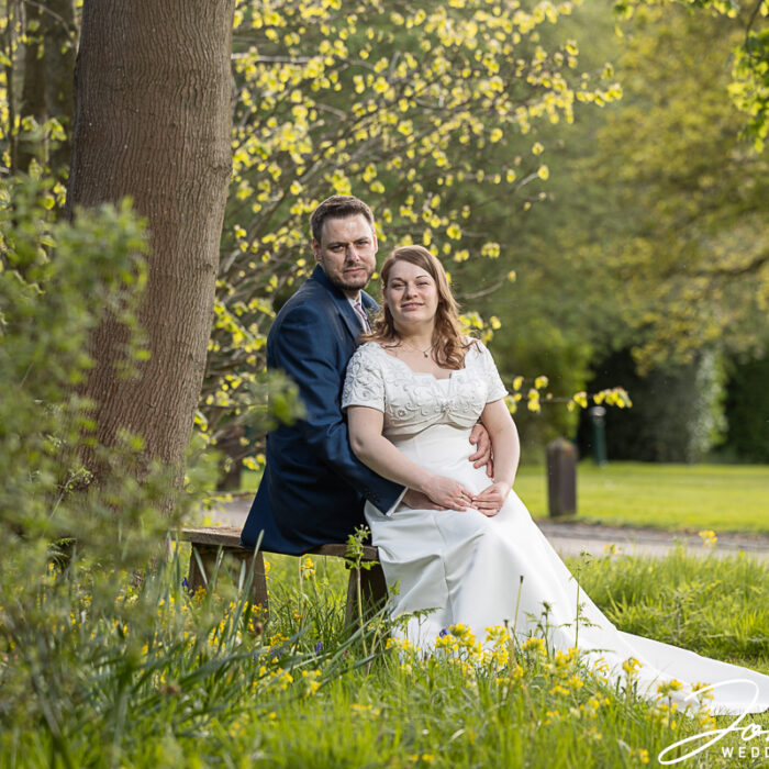 The bride and groom in the grounds at Kilworth House, Leicestershire