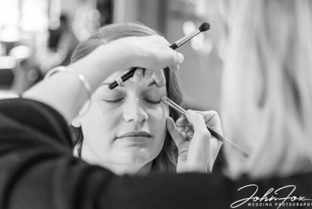 Natural Wedding photography Kilworth House Leicestershire. Bride's make up preparation.