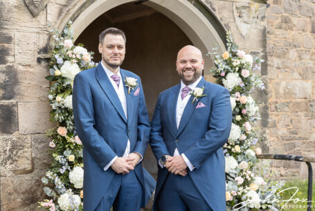 Groom and best man outside the church in Markfield