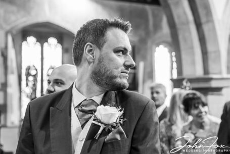 The groom patiently waits for his bride. John Fox Wedding Photography.