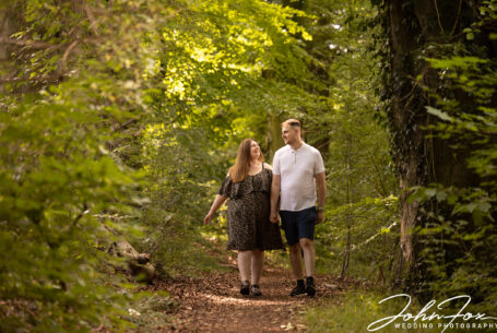 John Fox image of the couple walking in the grounds at Magnolia Park in Buckinghamshire