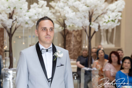 The groom waiting for the bride at the Buckinghamshire wedding.