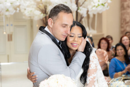 The Bride and Groom embracing at their Buckinghamshire wedding.