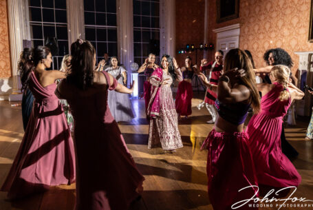 Bollywood dancing at the wonderful wedding in Buckinghamshire. Photo by John Fox Wedding Photography