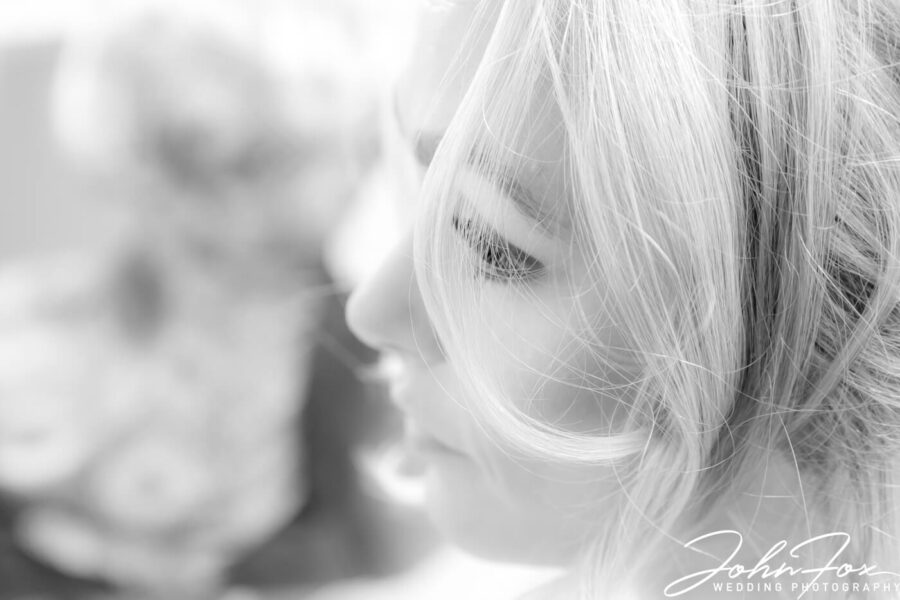 Close-up of the bride getting ready. Photo by John Fox Wedding Photography.