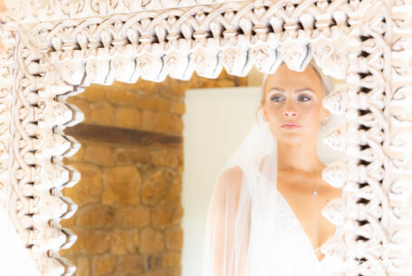 Bride in the mirror. Photo by John Fox Wedding Photography