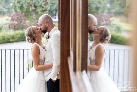 The newly weds kissing on their special day at Crockwell Farm.
