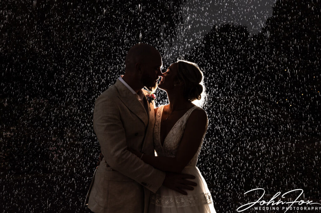 Wedding Photography at Crockwell Farm in Northamptonshire. A signature rain shot by John Fox Wedding Photography.