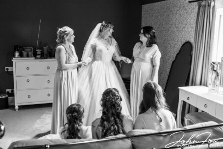 Bride and her bridesmaids getting ready at Meadow Barn at The Stratford Park Hotel