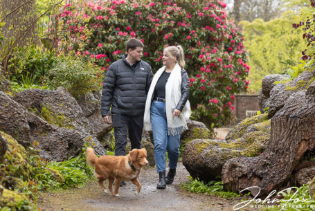 Bride and Groom to be and their pet dog in the gardens and grounds of Ashridge House