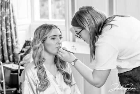 Lorna having her make-up applied in preparation for her Chicheley Hall wedding