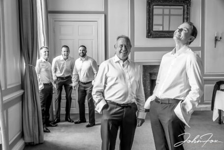 The groom, James, and his groomsmen share a joke before the wedding ceremony at Chicheley Hall in Buckinghamshire