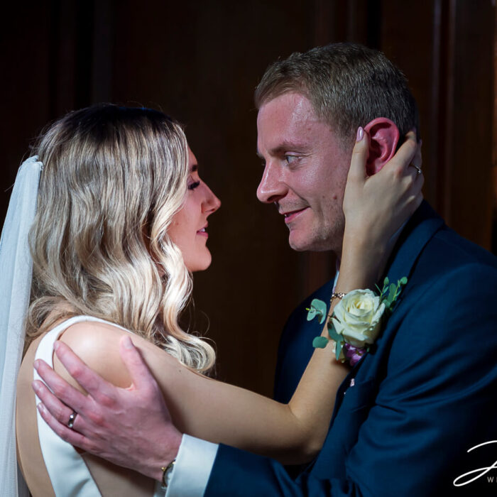 James and Lorna embracing each other in a quiet part of Chicheley Hall.