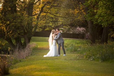 Bride and Groom sharing a kiss in the gardens of Chicheley Hall