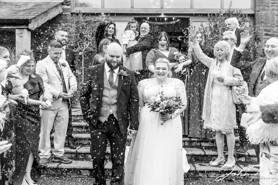 Bride, groom and the guests confetti shot at Crockell Farm