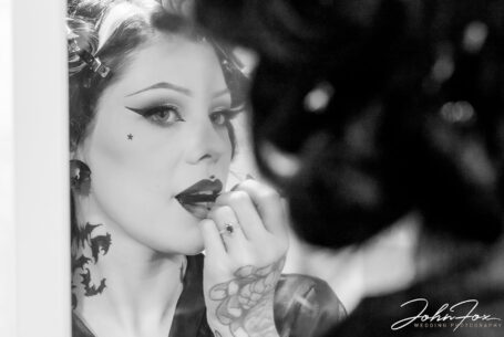 Gothic Wedding with a Stunning Bride in Black on Halloween - The bride adding her makeup.