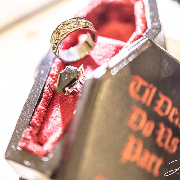 The wedding rings in a miniature coffin case.