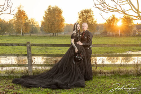 The happy couple in the grounds at Moreteyne Manor as the sun sets behind them
