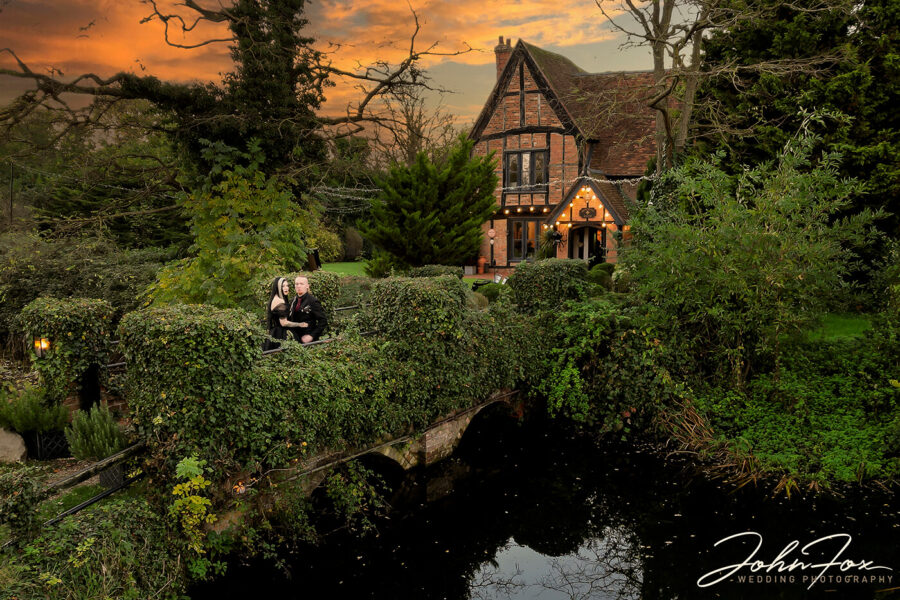 An evening shot of the Gothic couple outside Moreteyne Manor, Bedfordshire
