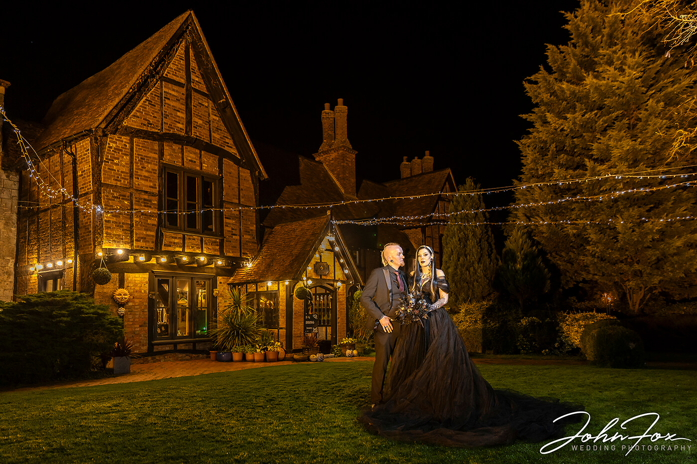 Gothic Wedding night photo with the newly-wedded couple outside Moreteyne Manor