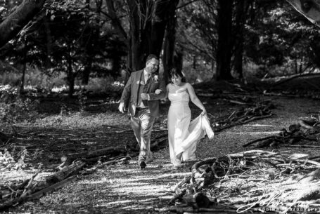 Black and white image of bride and groom in the grounds of Missenden Abbey by John Fox Wedding Photography