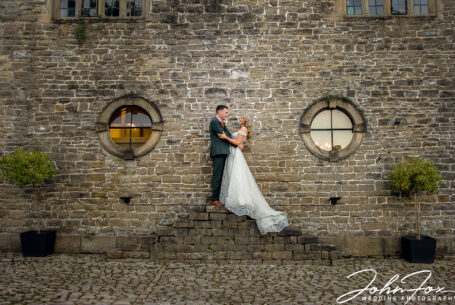Wedding Photographer at Tissington in Derbyshire. The happy couple outside the Hall.