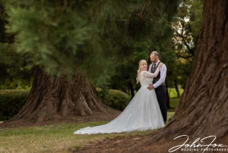 Wedding photograph of the bride and groom in the gardens and grounds of Kilworth House