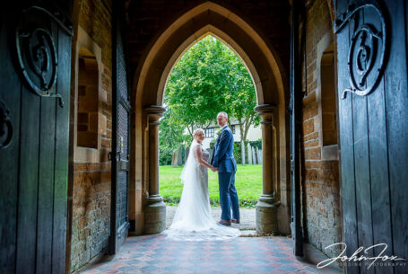 Bride and Groom at the church door in Welford, Leicestershire