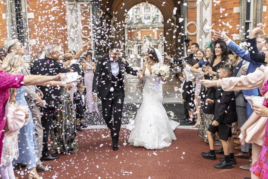 Congratulations on Your Engagement! Bride and groom with guests throwing confetti