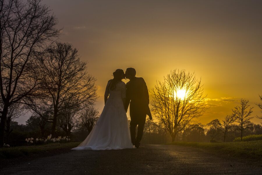 Congratulations on Your Engagement! Bride and groom walking off into the sunset.