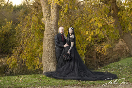 Gothic Couples wedding photograph taken by the moat at Moreteyne Manor by John Fox Wedding Photography