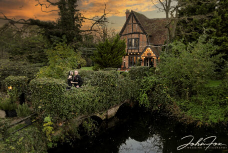 Gothic Couples wedding photograph taken with a drone with Moreteyne Manor in the background