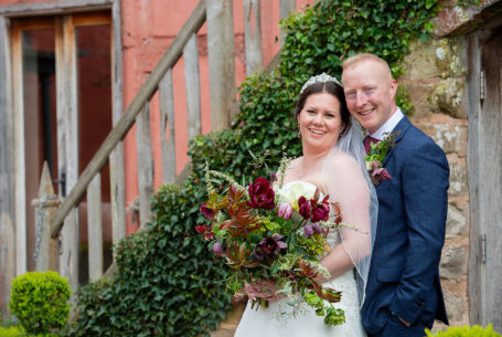Outside Pauntley Court with the bride and groom. Image by John Fox Wedding Photography.