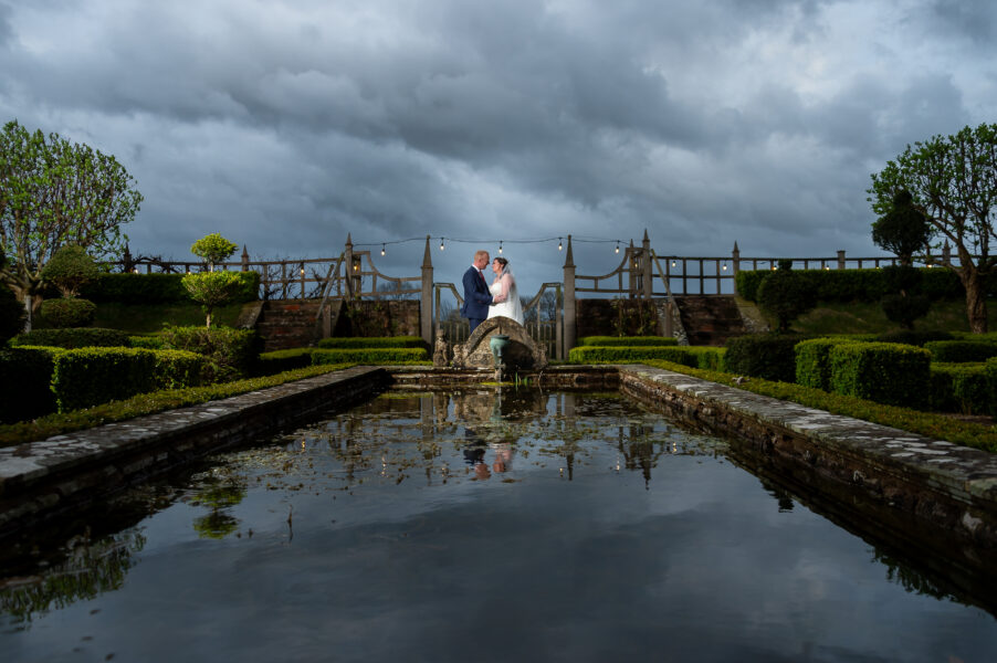 Image by John Fox Wedding Photography of the bride and groom enjoying a moment together outside Pauntley Court
