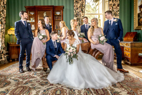 Cross over between classic and documentary wedding photograph of a bridal party