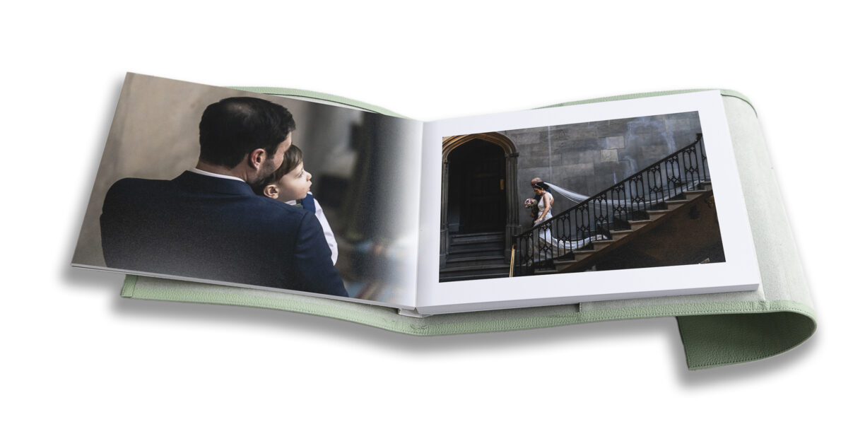 Wedding album showing design flow telling the story. Groom and son looking towards bride and father walking down the stairs