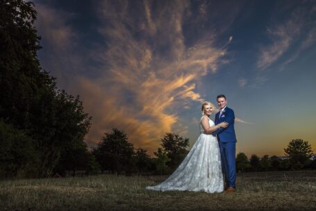 Bride and groom with stunning sunset sky. The Venue Group and John Fox Wedding Photography