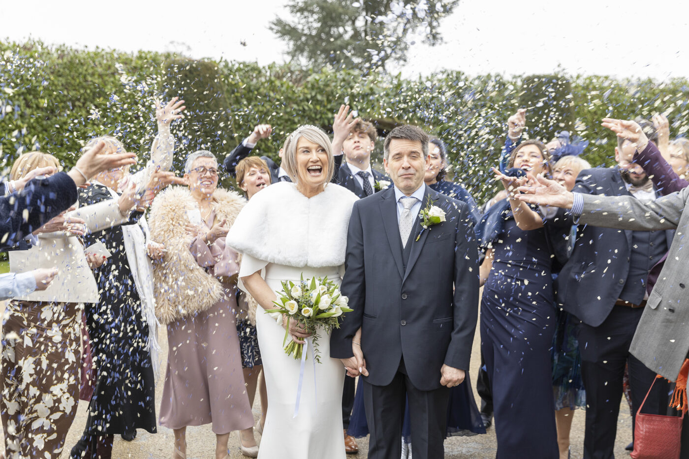 Wedding Confetti Photos. Groom pulling a funny face