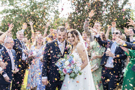 Wedding Confetti Photos. Bride and Groom showered with confetti.