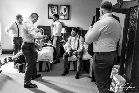 Groom and groomsmen getting ready at Peckforton Castle, Cheshire. Photo by John Fox.